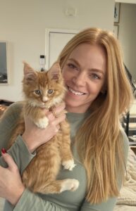 Kelly with Meteora ⋆ Sassy Koonz Maine Coon Cattery ginger maine coon kitten with red headed owner